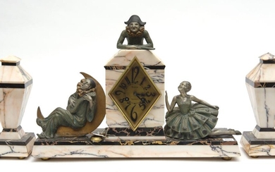 AN ART DECO THREE PIECE SPELTER AND MARBLE CLOCK GARNITURE, THE DIAL SIGNED 'BESNIER / COMPIÈGNE', THE BODY MOUNTED WITH COMMEDIA DE.