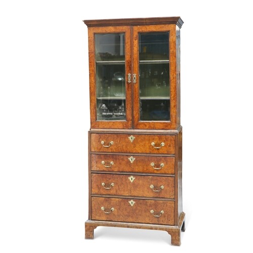 AN EARLY 18TH CENTURY WALNUT CABINET ON CHEST, the upper sec...