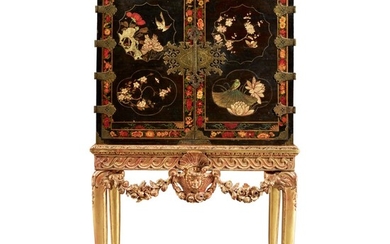AN ENGLISH JAPANNED CABINET INCORPORATING CHINESE LACQUER PANELS IN THE DOORS, EARLY 18TH CENTURY