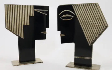 After Franz Hagenauer, two stylised busts, second half 20th century, in ebonised...