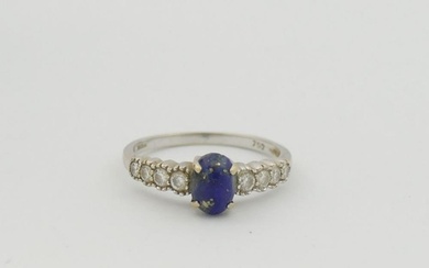 An 18 carat white gold lapis lazuli and diamond ring, the ov...