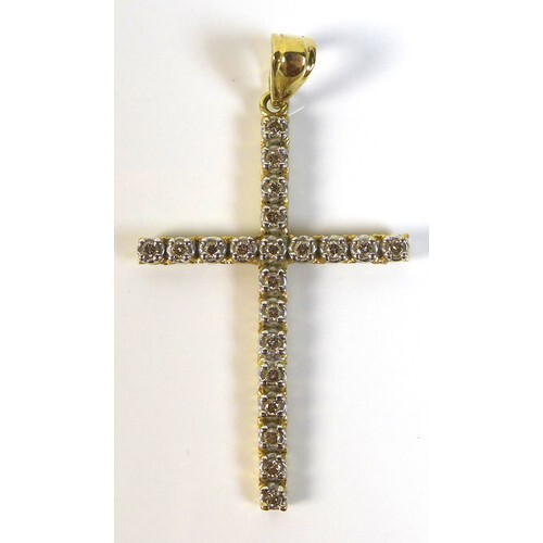 An 18K gold and diamond cross shaped pendant, set with twent...