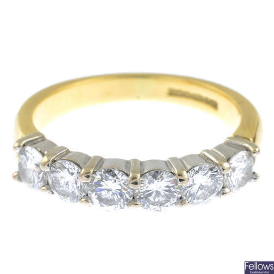 An 18ct gold brilliant-cut diamond six-stone ring.