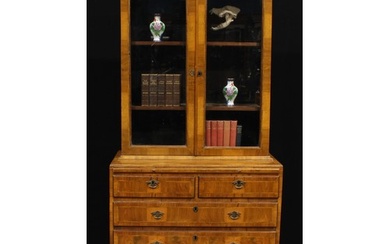An 18th century and later walnut library bookcase, outswept ...
