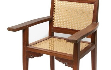 An Anglo Indian teak and cane paneled armchair