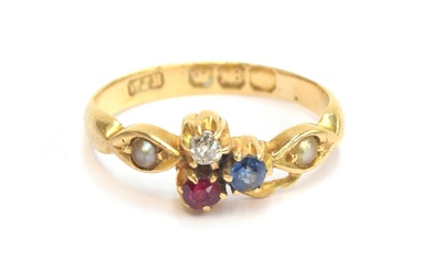 An Edwardian 18ct gold ring set with a diamond, ruby and sap...