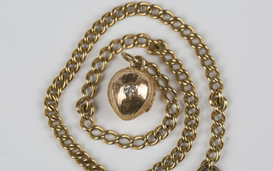 An Edwardian gold and diamond single stone pendant, designed as a nut, unmarked, weight 2.7g, length