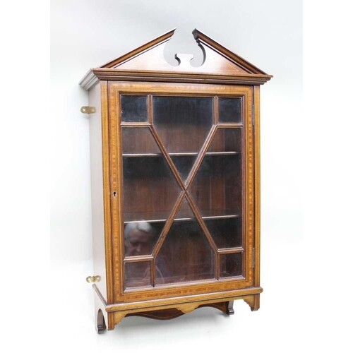 An Edwardian mahogany finished hanging wall cupboard with sh...