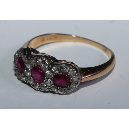 An Edwardian ruby and diamond cluster ring, tree panel clust...
