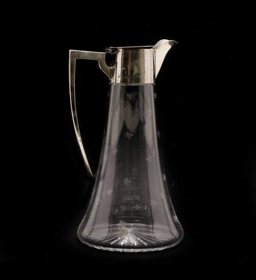 An Edwardian silver mounted and cut glass claret jug