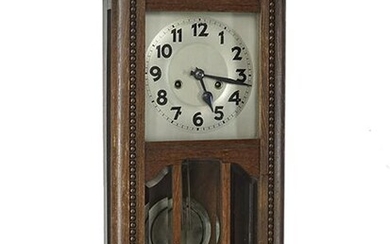 An Oak Wall Clock.
