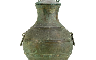 An archaic copper-inlaid bronze wine vessel, hu, Eastern Zhou dynasty, Warring States period 東周戰國時期 青銅嵌紅銅蟠螭紋壺