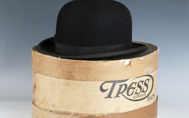 An early 20th century bowler hat by Tress & Co, London, head circumference 61cm, with cream silk