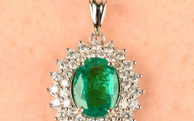An emerald and brilliant-cut diamond cluster pendant.