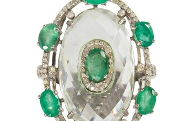An emerald, diamond and rock crystal ring
