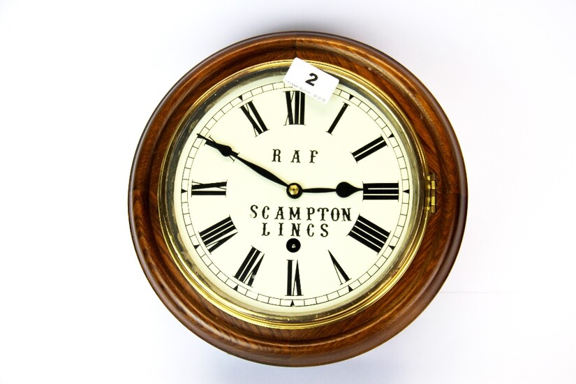 An oak wall clock, Dia. 27cm. (no pendulum).