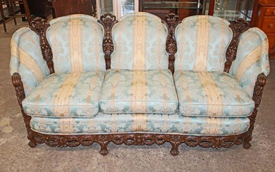 Antique highly carved and ornate walnut frame 3 cushion parlor sofa