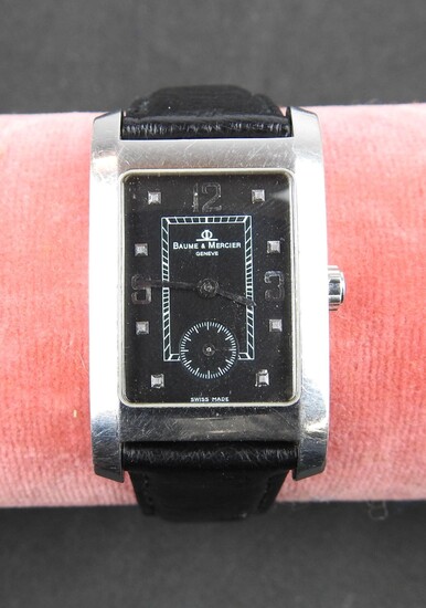 BAUME & MERCIER à Geneve : Montre bracelet d'homme en acier, cadran fond noir. Index...