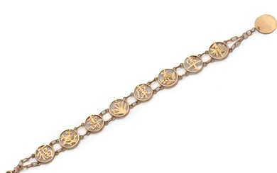 Bracelet articulé en or 750 millièmes, composé d'une ligne de maillons ronds ajourés à décor...