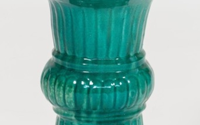 CHINESE GLAZED POTTERY GARDEN SEAT In urn form, under a green glaze with blue and green top. Height 20.25".