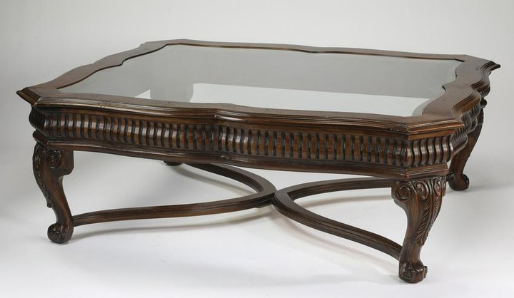 Carved mahogany glass top coffee table
