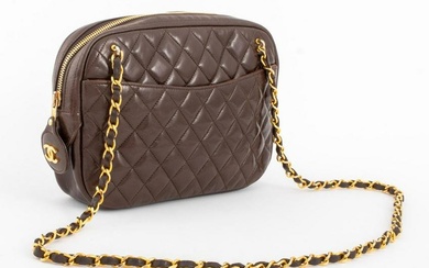 Chanel quilted brown calfskin leather camera handbag with front and back pockets, gold-tone metal