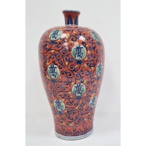 Chinese vase of ovoid form, decorated with blue trailing spa...