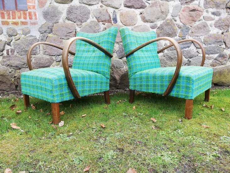 Danish furniture design: A pair of Art Deco easy chairs with stained wood armrests and legs, upholstered with checkered fabric. 1930–40s. (2)