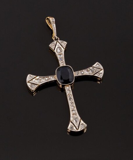 Delicate cross in 18k (750 thousandths) yellow gold and platinum...