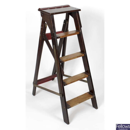 Early 20th century mahogany step ladders, together with a mahogany desk-top stationary rack and hand painted armorial crest.