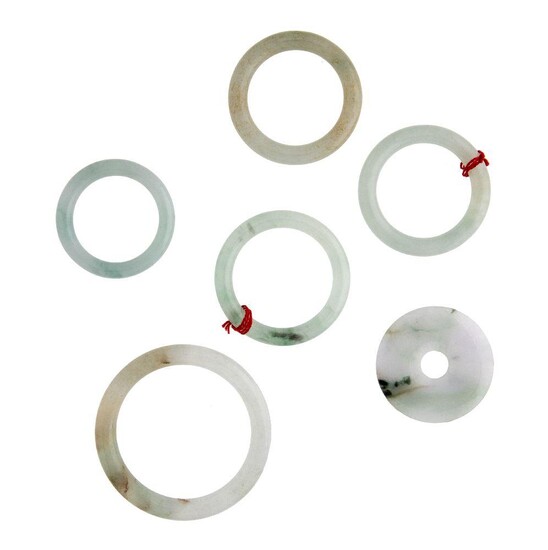Five jadeite hoops and a pi disc, diameter 1 x 7cm, 3 x 5cm, 1 x 4.5, and 4.5cm for the pi disc. Please note that the Jade has not been tested for colour treatment