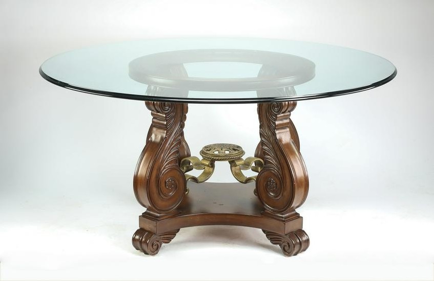 Glass top center table with carved scrolling legs