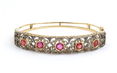 Gold and silver rigid hoop bracelet Gold and silver rigid bracelet with rubies and diamonds, Early 20th century