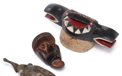 Helmet mask and two other masks of carved patinated wood painted with red, white and black. Dan and Baulé style. (3)
