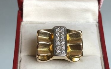 IN CHARGE OF CONTROL. Gold "tank" ring with...