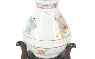 Japanese Kakiemon decorated porcelain vase with figural
