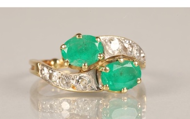 Ladies Emerald and Diamond ring, two oval cut emeralds in tw...