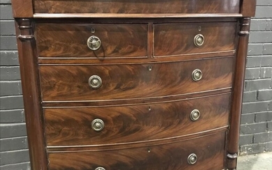 Late Georgian Mahogany Bow Front Chest of Drawers, with concealed frieze drawer & five further drawers, raised on turned feet.