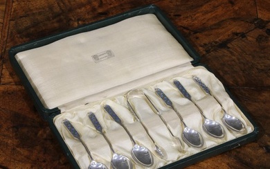Liberty & Co - a set of six Arts and Crafts Cymric silver an...