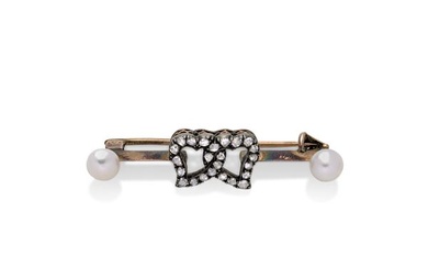 Love brooch in low title gold, diamonds and cultured pearls