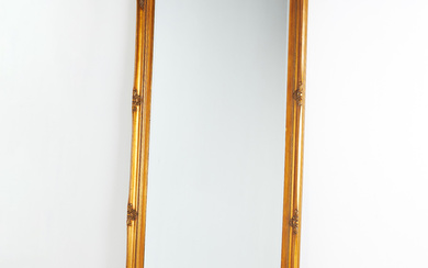 MIRROR. 20th century, pastellage, bronzed, facetted mirror glass.