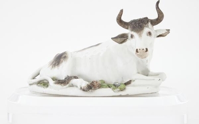 Meissen Porcelain Figure of a Recumbent Bull 18th Century On an oval base with flowers, crossed sword marks to side of b...