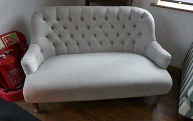Modern natural coloured button backed 2 seater sofa on limed...