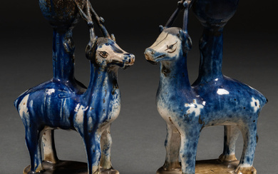 Pair of animal-shaped candlesticks in blue glazed ceramic. Chinese work,...
