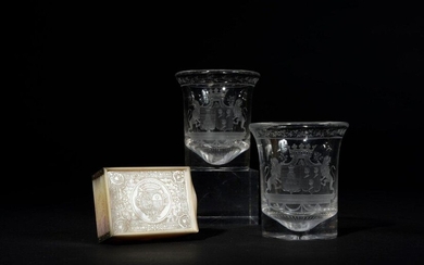 Pair of crystal goblets engraved with a garland of flowers and a wedding band coat of arms stamped with a ducal wreath edged with lions. Charles X period Height 9,5 cm
