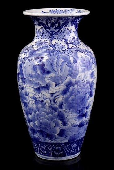 Porcelain vase with blue decor of birds in a floral