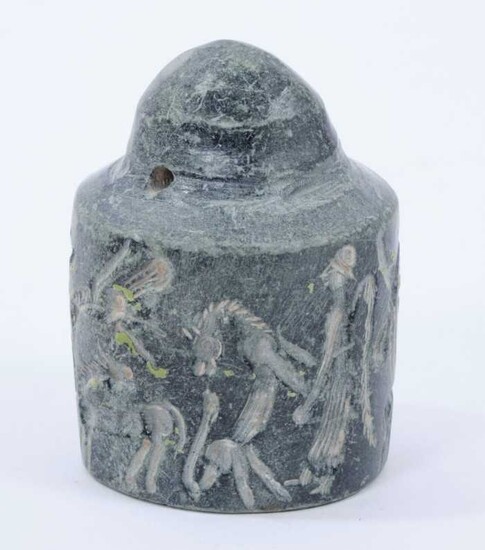 Rare early carved stone cylinder seal, possibly Assyrian, with pierced terminal and profusely carved with figures ans animals, similarly carved to the foot, 6cm high