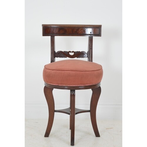 Regency mahogany music chair with upholstered seat raised on...