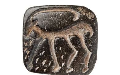 ‡ Stamp seal with Ibex, carved on black steatite or chlorite [Near East, fourth millennium BC.]