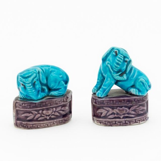 TWO SMALL TURQUOISE & AUBERGINE SEATED ELEPHANTS